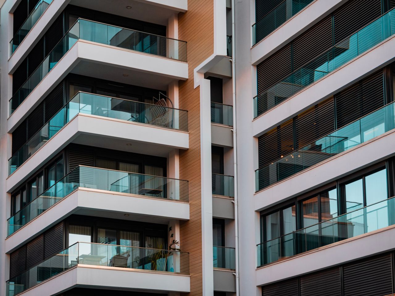 programs-01 Contemporary architecture showcasing glass balconies and sleek design.