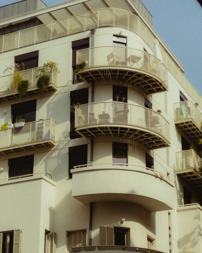 our-facilities-02 Contemporary architecture showing balconies in a Tel Aviv apartment building.