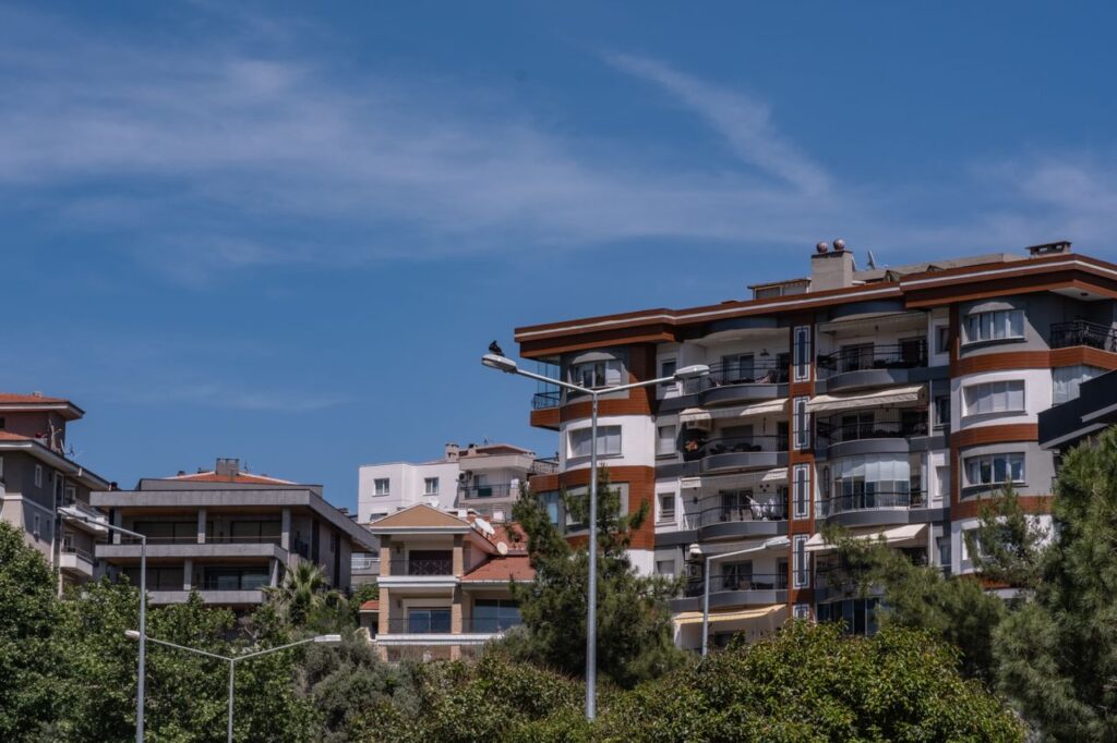 Crafting Captivating Headlines: Your awesome post title goes here Stylish urban apartments in Bornova, İzmir under a clear blue sky.